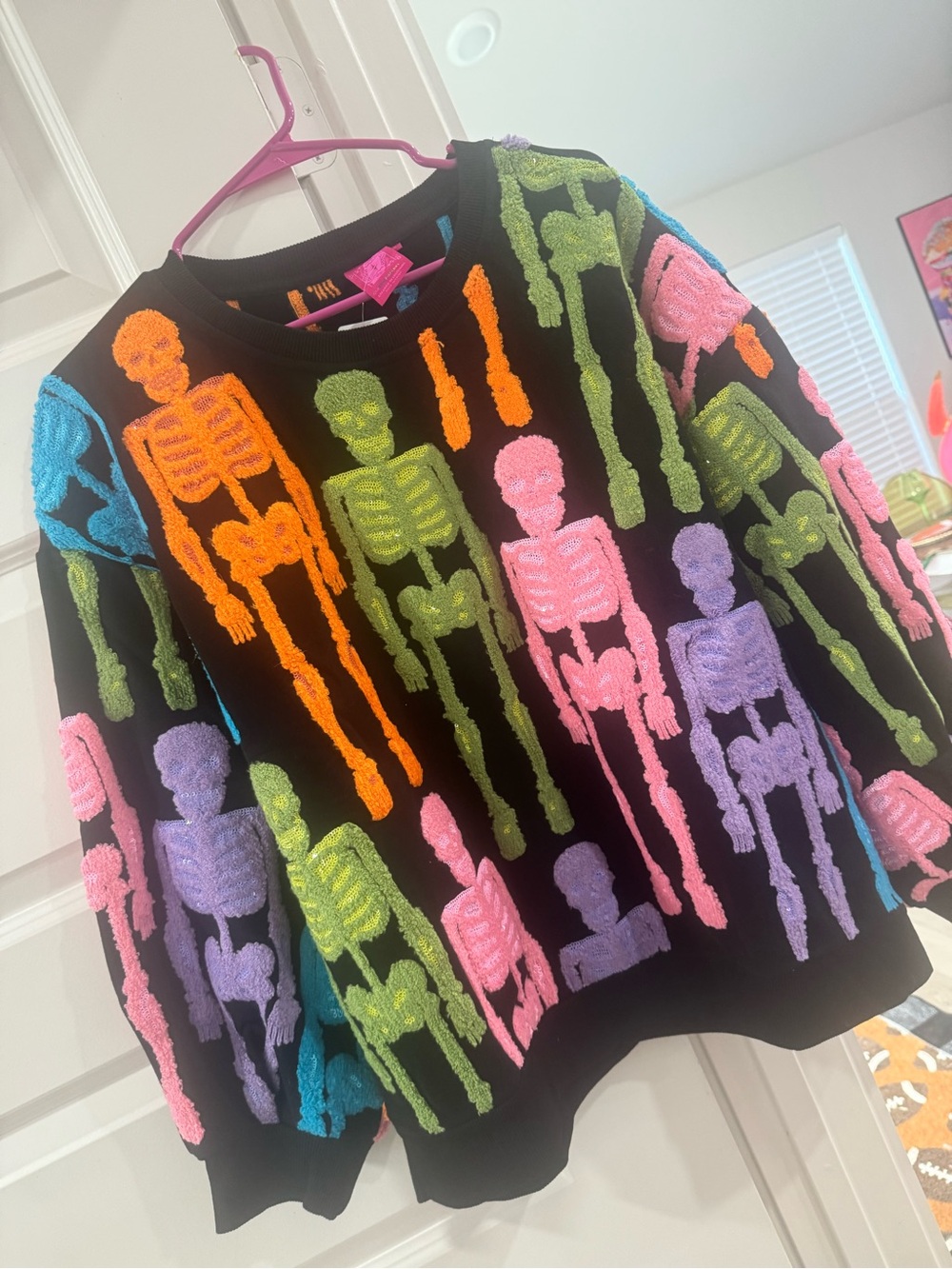 QUEEN OF SPARKLES Black Crewneck Sweater with Neon Skeletons
